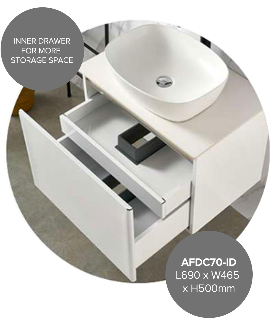 White vanity sink with open drawer showing storage space.