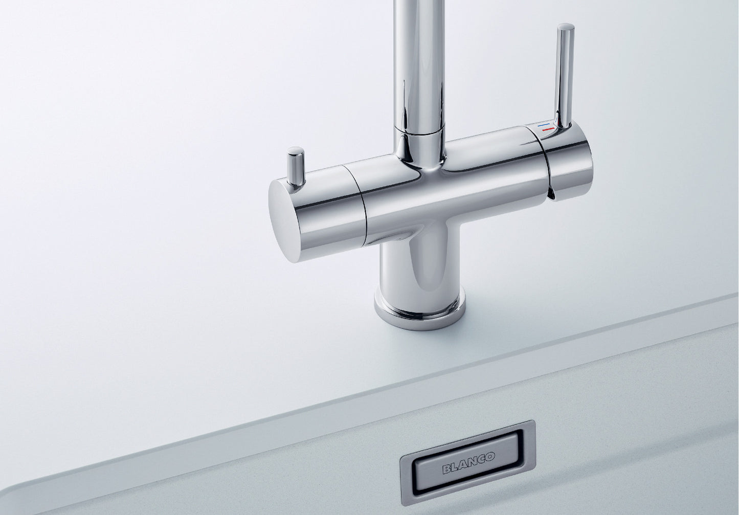 Close-up product cutout of the BLANCO Fontas-S II base, emphasizing the dual control levers. The right lever operates standard mains water, while the dedicated left lever manages the drink filter set output, illustrating the symmetrical 3-way system.