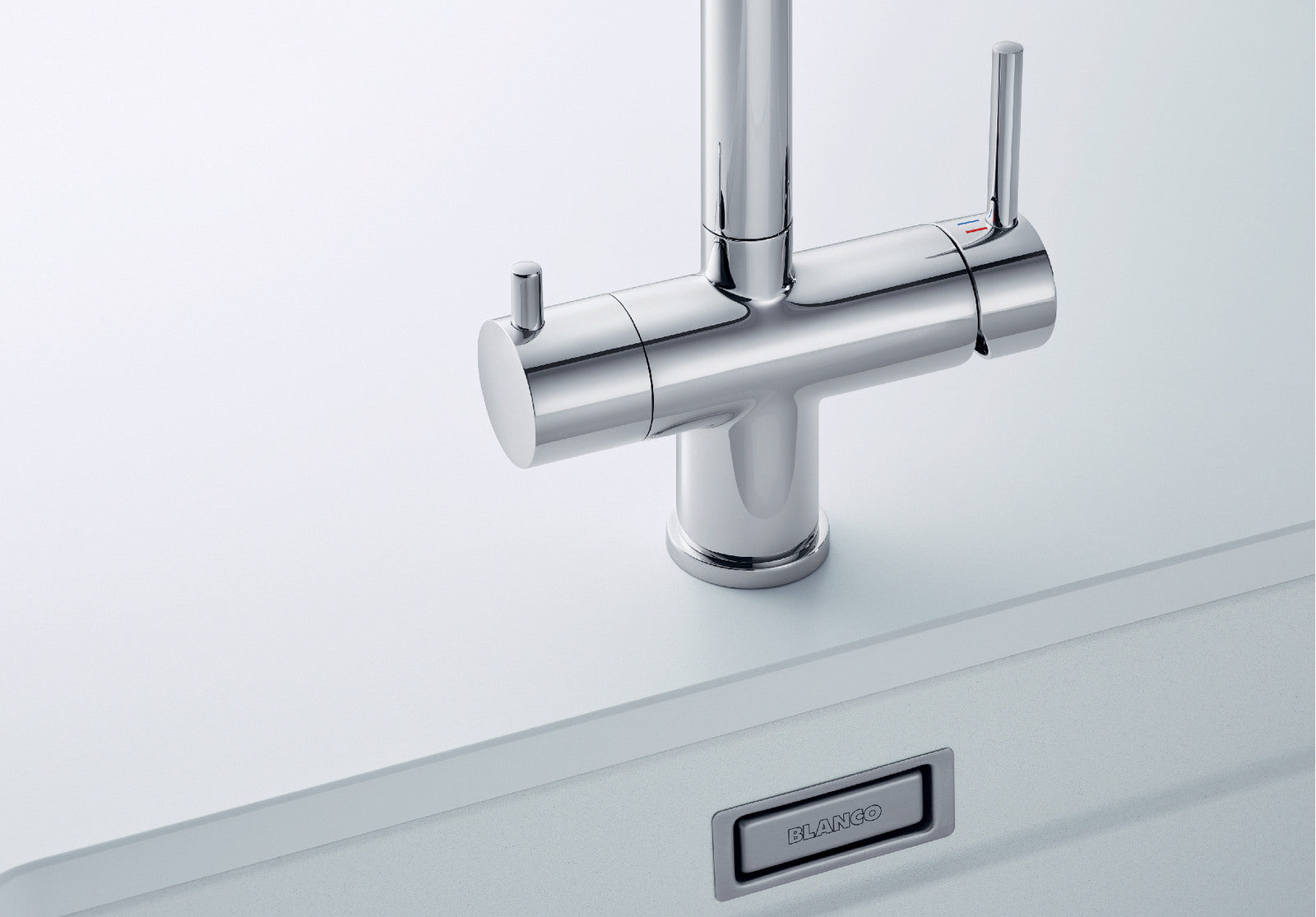 Close-up product cutout of the BLANCO Fontas-S II base, emphasizing the dual control levers. The right lever operates standard mains water, while the dedicated left lever manages the drink filter set output, illustrating the symmetrical 3-way system.