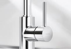 Detailed close-up of the BLANCO Mida base, emphasizing the high-quality Chrome plating and the ergonomic, slimline single-lever control.