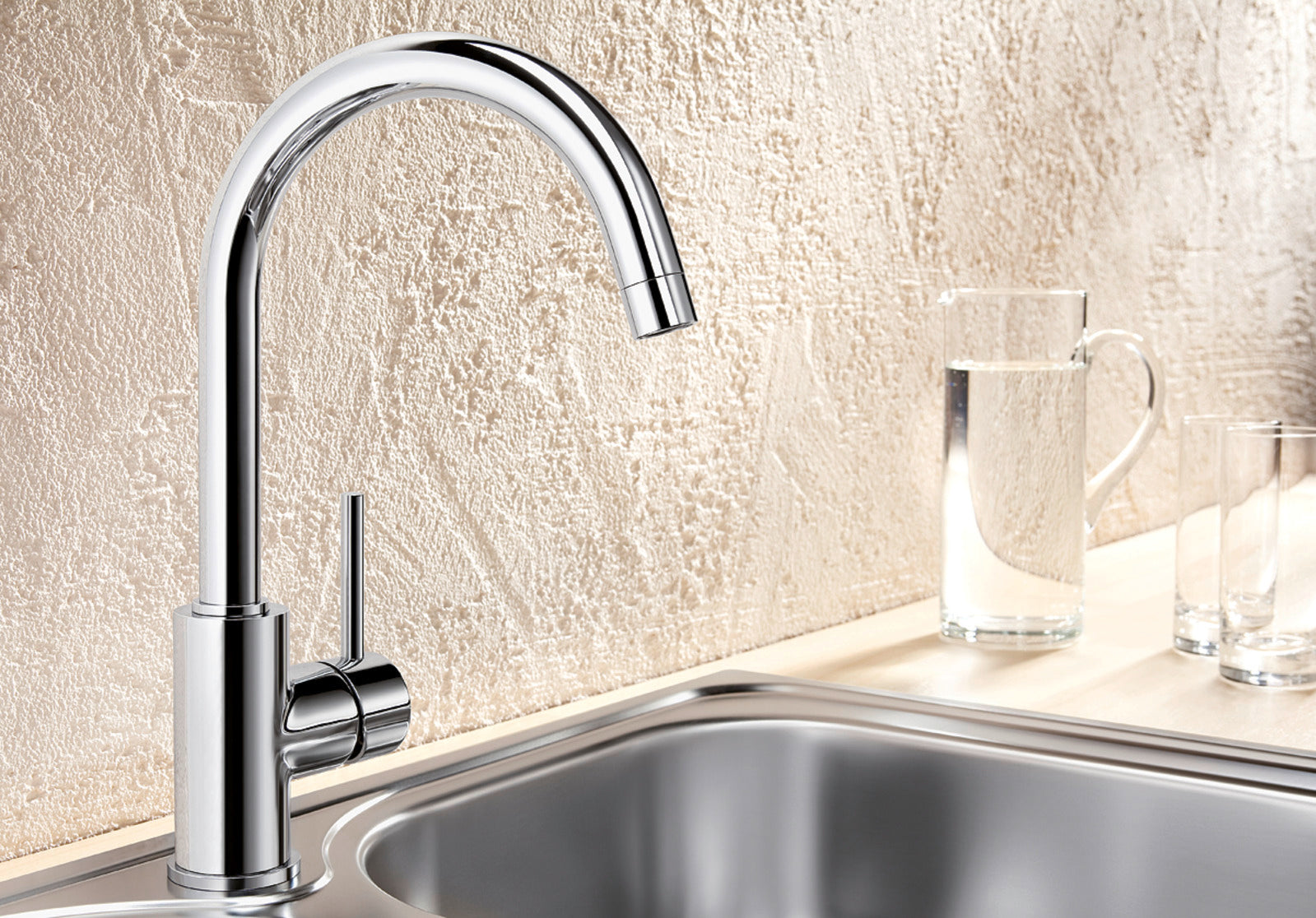 High-resolution shot of the BLANCO Mida in Chrome, showcasing its small footprint, on a kitchen counter top