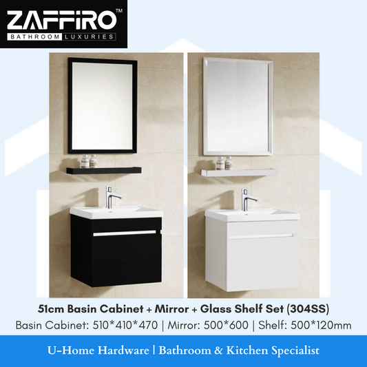 A basin cabinet set that includes a stainless steel basin cabinet in white, a rectangular mirror, and a glass shelf, all arranged in a bathroom setting. The brand 'ZAFFIRO' is visible on the image.